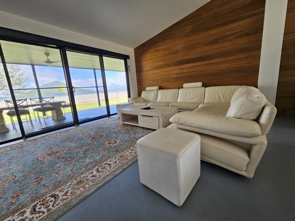 L shaped cream sofa allowing you to overlook the ocean
