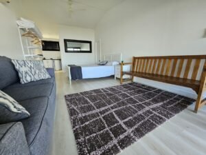 One of Two clean and modern units with a queen sized bed